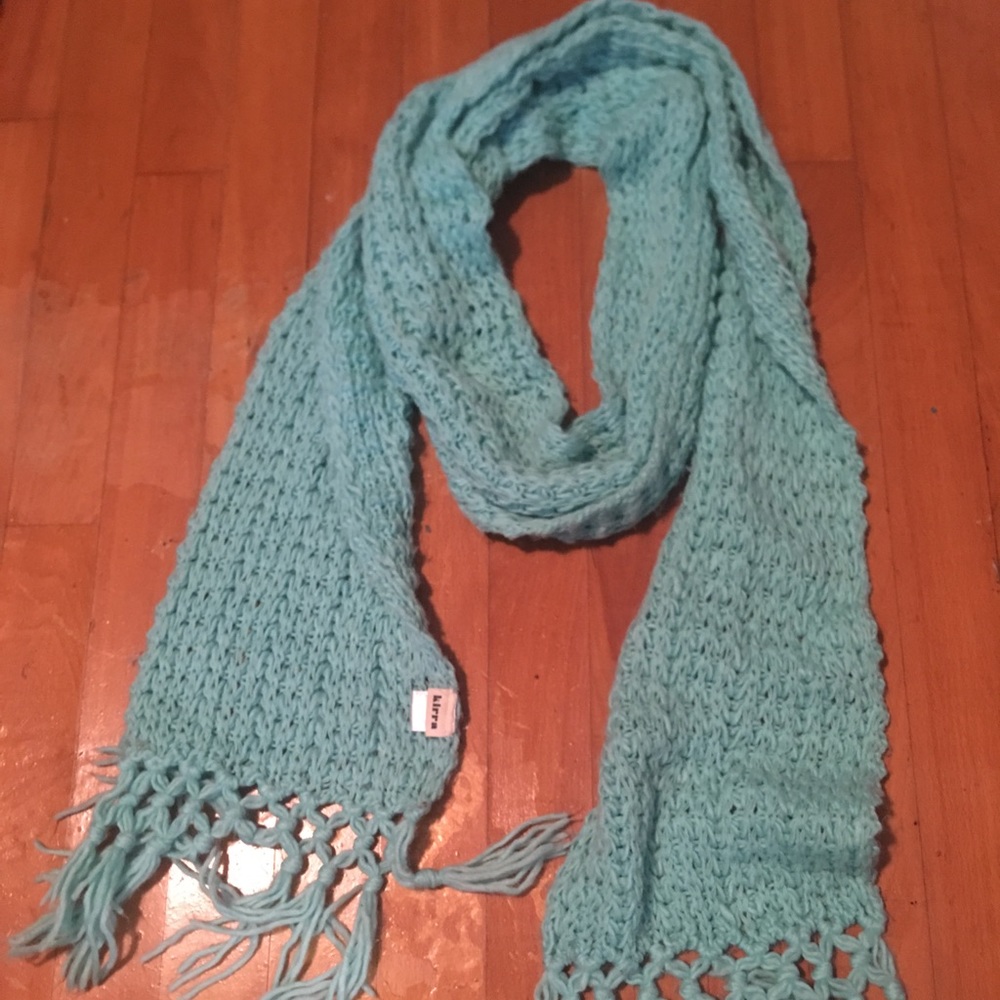 Turquoise knitted scarf.